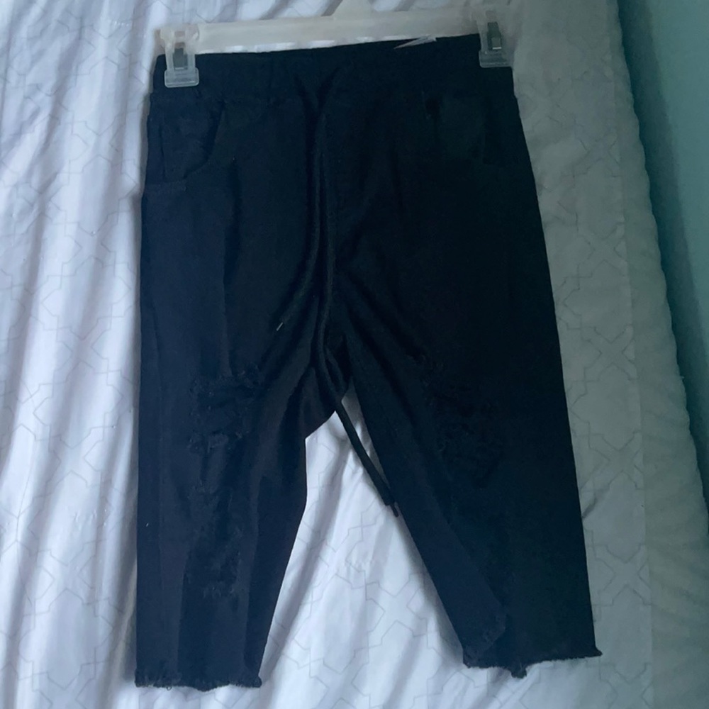 Black ripped capris
